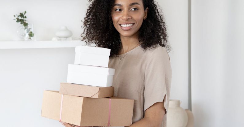 Packing For Barcelona - A Woman Holding Cardboard Boxes