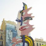 Street Art Barcelona - Creative sculpture representing female face located on sunny street