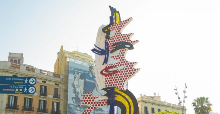 Street Art Barcelona - Creative sculpture representing female face located on sunny street