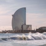 Barcelona Beach - Person Surfing With High-rise Building Background