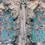 Historic Hotels Barcelona - From below of aged stone Sagrada Familia church with carved elements and sculptures in Gothic style in Barcelona