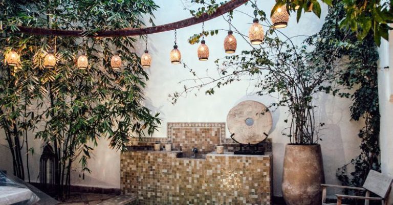 Spa Hotels Barcelona - Traditional oriental hammam pool on exotic resort spa terrace decorated with lush plants and stylish lanterns