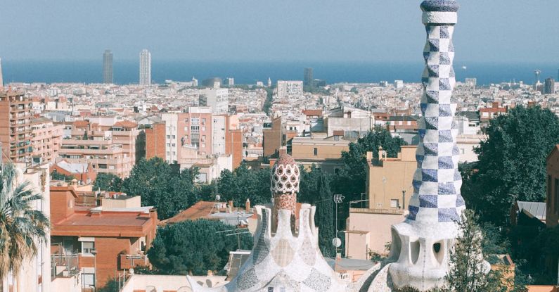 Viewpoints Barcelona - Surrealistic architecture of towers and gardens against modern cityscape in sunny summer day in Spain