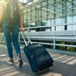 Airport To City Barcelona - Woman Walking on Pathway While Strolling Luggage