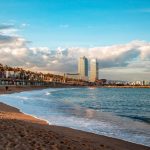 Barcelona Beach - city skyline across the sea during daytime