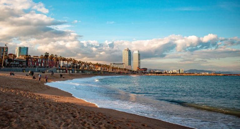Barcelona Beach - city skyline across the sea during daytime
