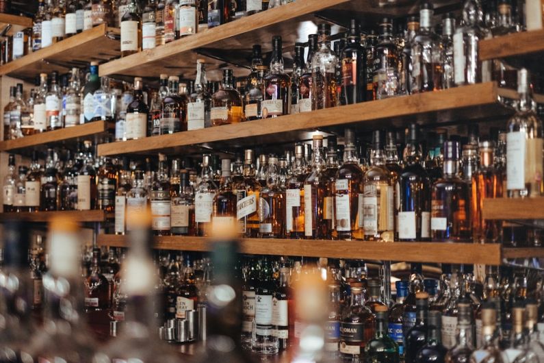 Alcohol - assorted-color bottle lot on shelf