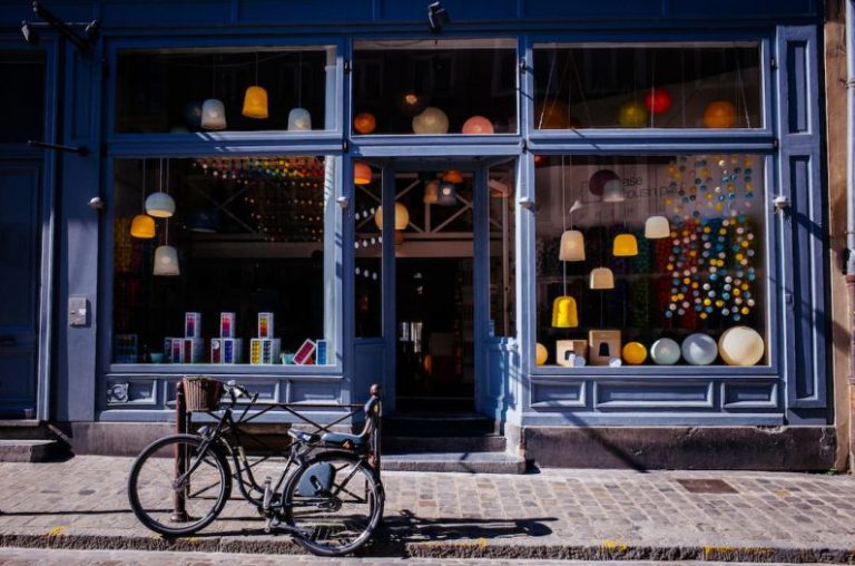 Shops - black trike parked near soter