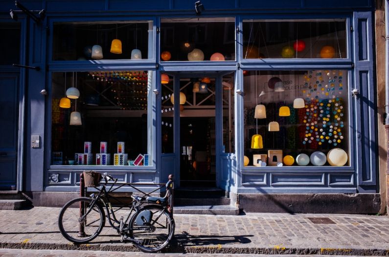 Shops - black trike parked near soter