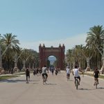 Barcelona - people running and riding bicycles on cement