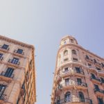 Barcelona - worm's eyeview photo of beige high-rise buildings