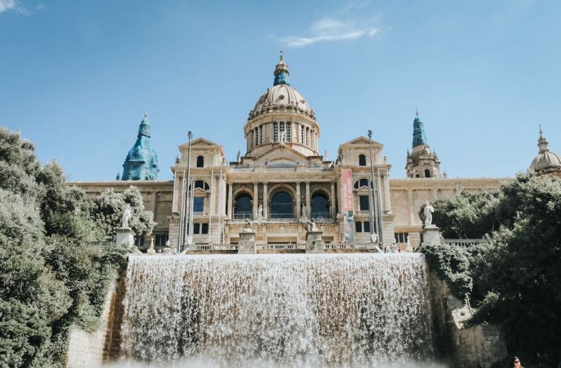 Barcelona - beige building near waterfalls