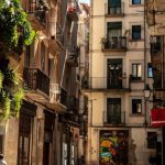 La Rambla - Black Motorcycle Beside of Brown Painted Buildings