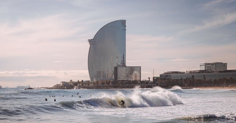 Barcelona - Person Surfing With High-rise Building Background