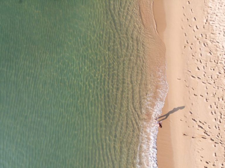 Barcelona Beach - person standing near shoreline