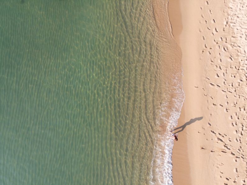Barcelona Beach - person standing near shoreline
