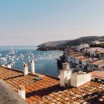 Catalonia - white boat lot on sea beside mountain