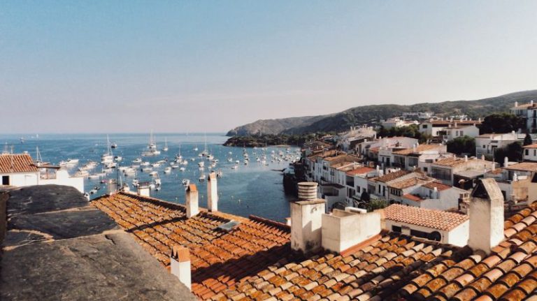 Catalonia - white boat lot on sea beside mountain