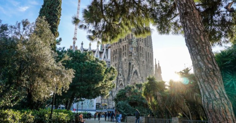 Barcelona - Group of People Walking in Front of Sagrada Familia Cathedral